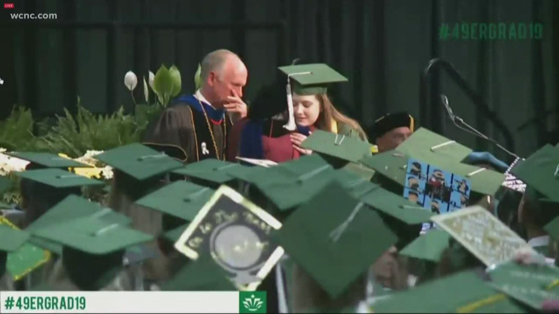 Several students graduating decorated their grad caps with the #CharlotteStrong phrase in memory of the two lives lost and four students injured in the campus shooting.