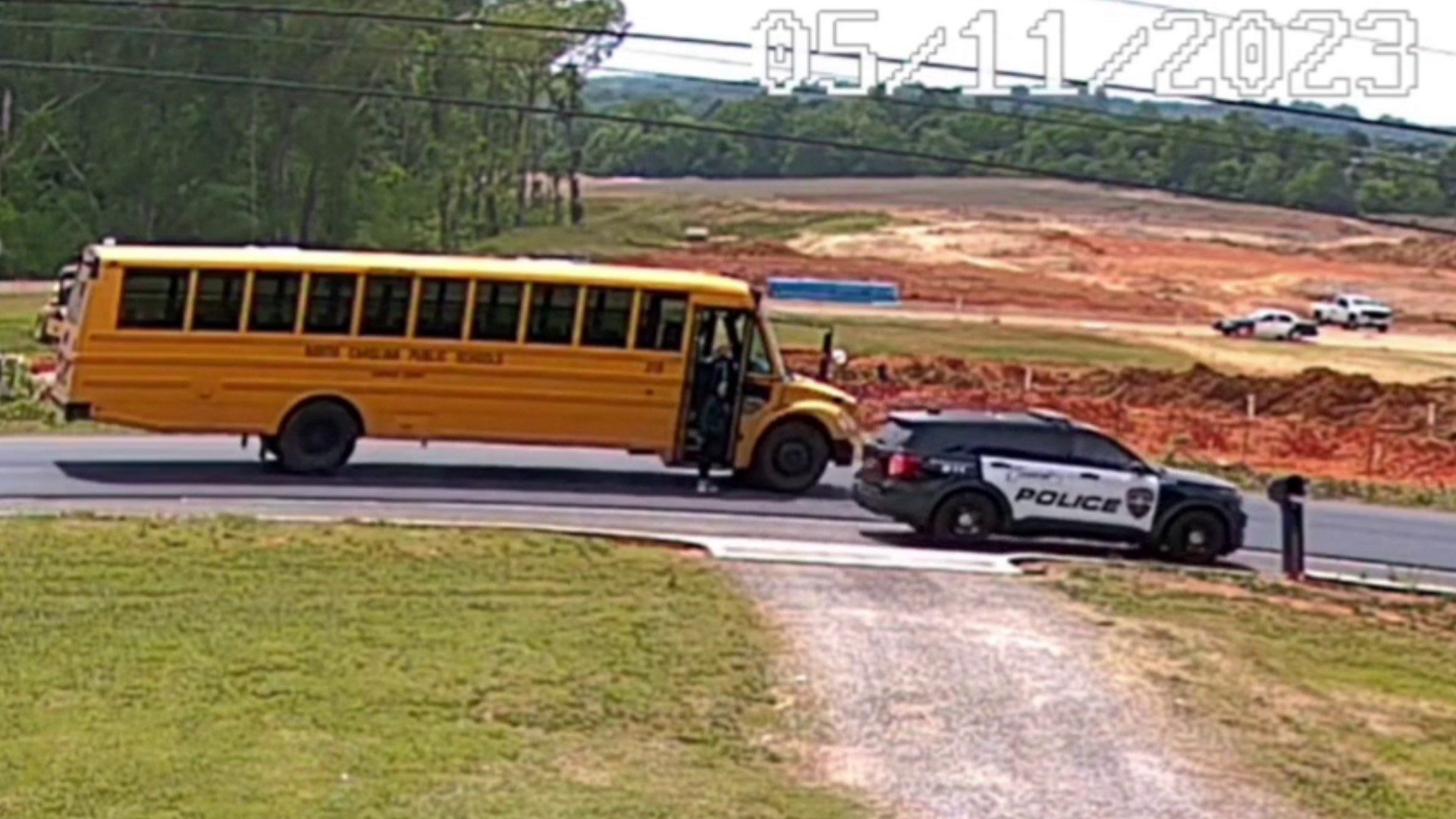 A student had just exited the stopped Cabarrus County school bus when a Concord police car passes the stopped school bus nearly missing the student.