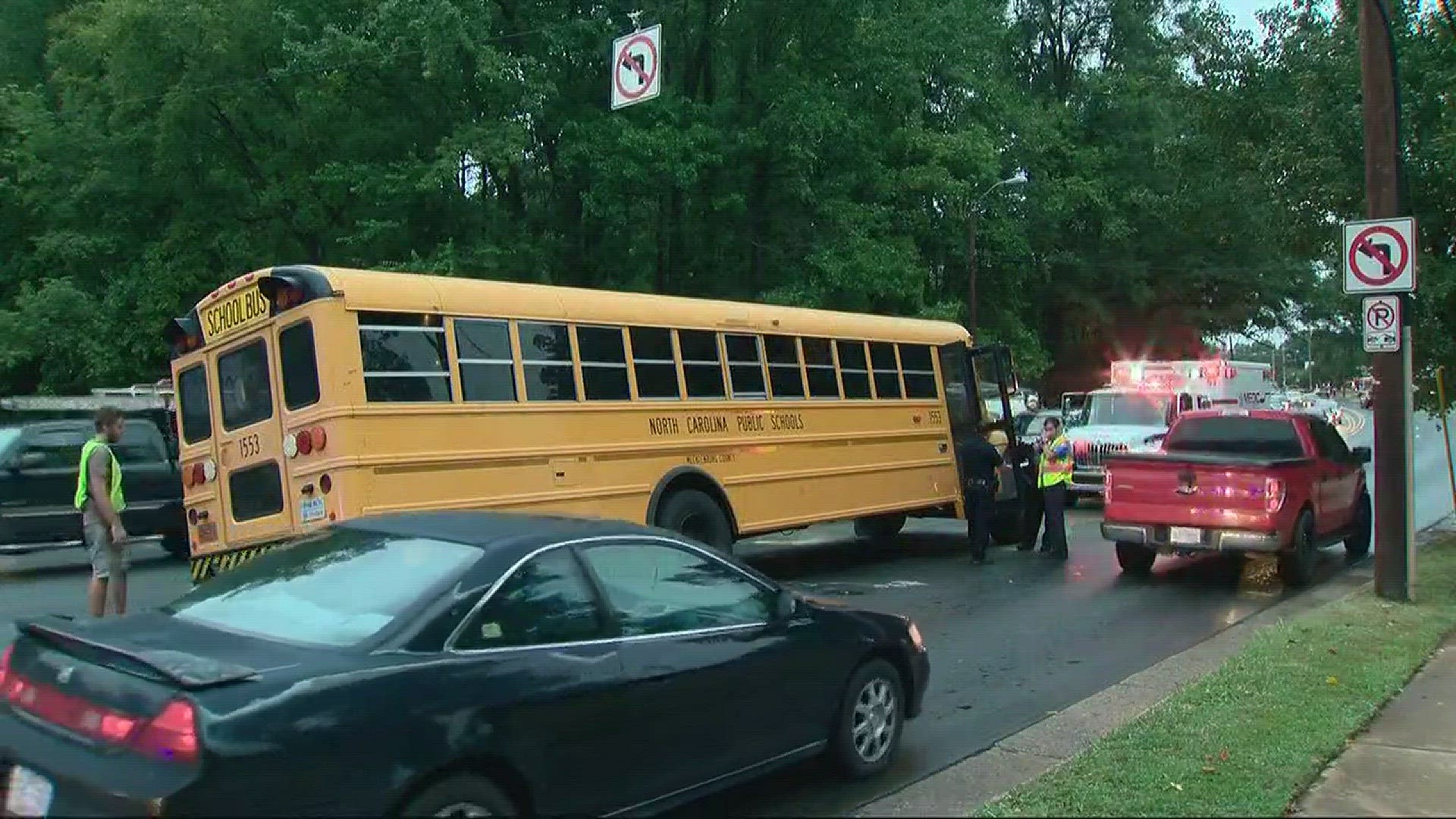 A wheel reportedly came off the bus and smashed the front of a red car.