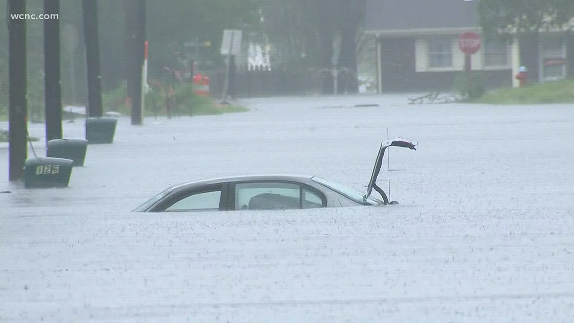 In Jacksonville North Carolina, flood waters from Florence have almost completely covered a car.