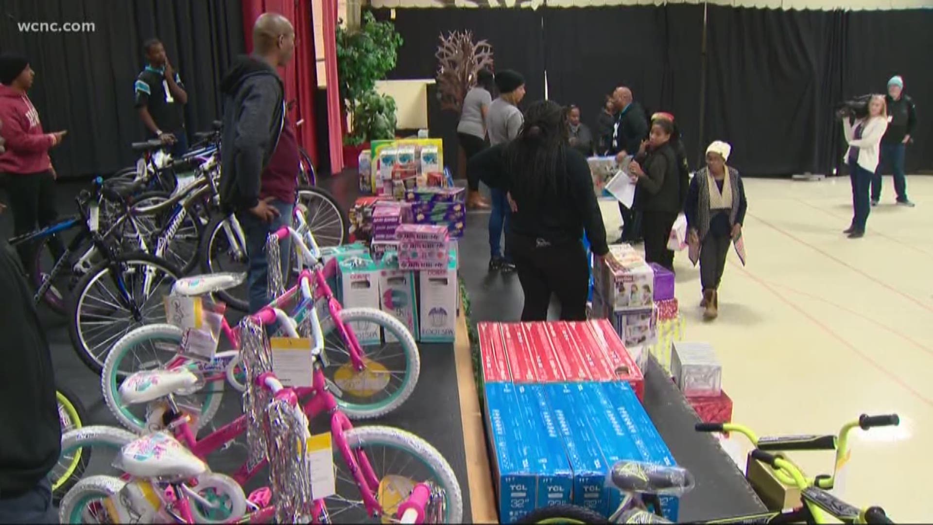 Carolina Panthers teammates Thomas Davis and Mike Adams spent their Tuesday giving away tons of toys to needy Charlotte children.