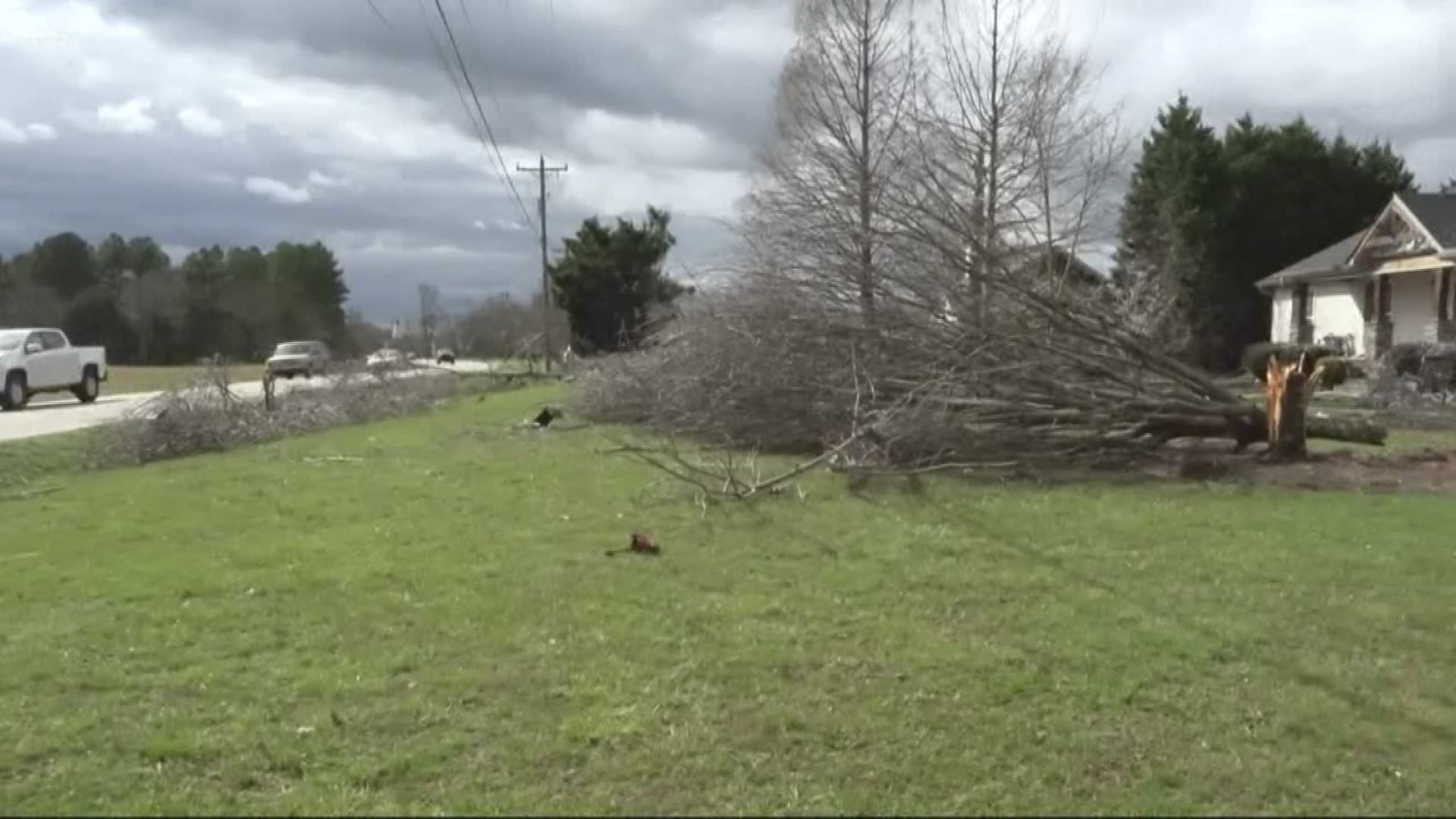 Power crews in Cabarrus County rolling out new lines and battling strong winds after a tornado ripped wires from poles leaving homes and traffic light without power.