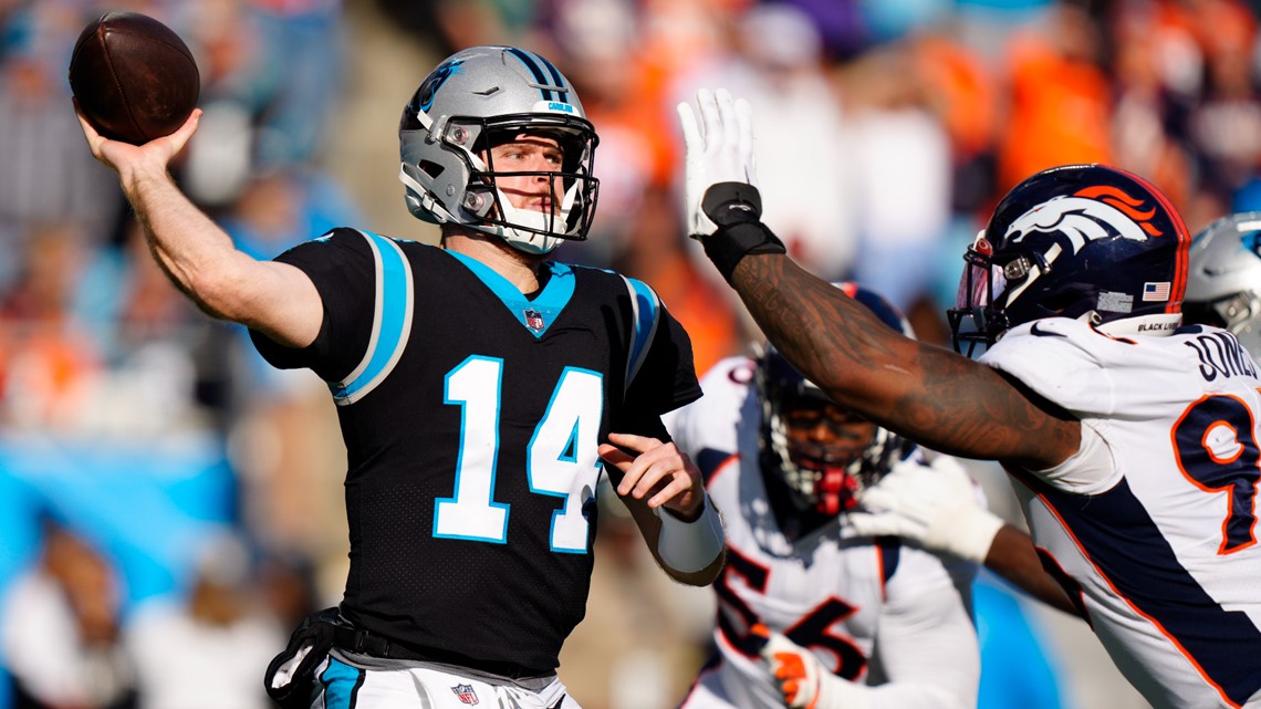 Carolina Panthers quarterback Sam Darnold (14) throws during an NFL  football game between the Carolina Panthers and the Denver Broncos on  Sunday, Nov. 27, 2022, in Charlotte, N.C. (AP Photo/Jacob Kupferman Stock