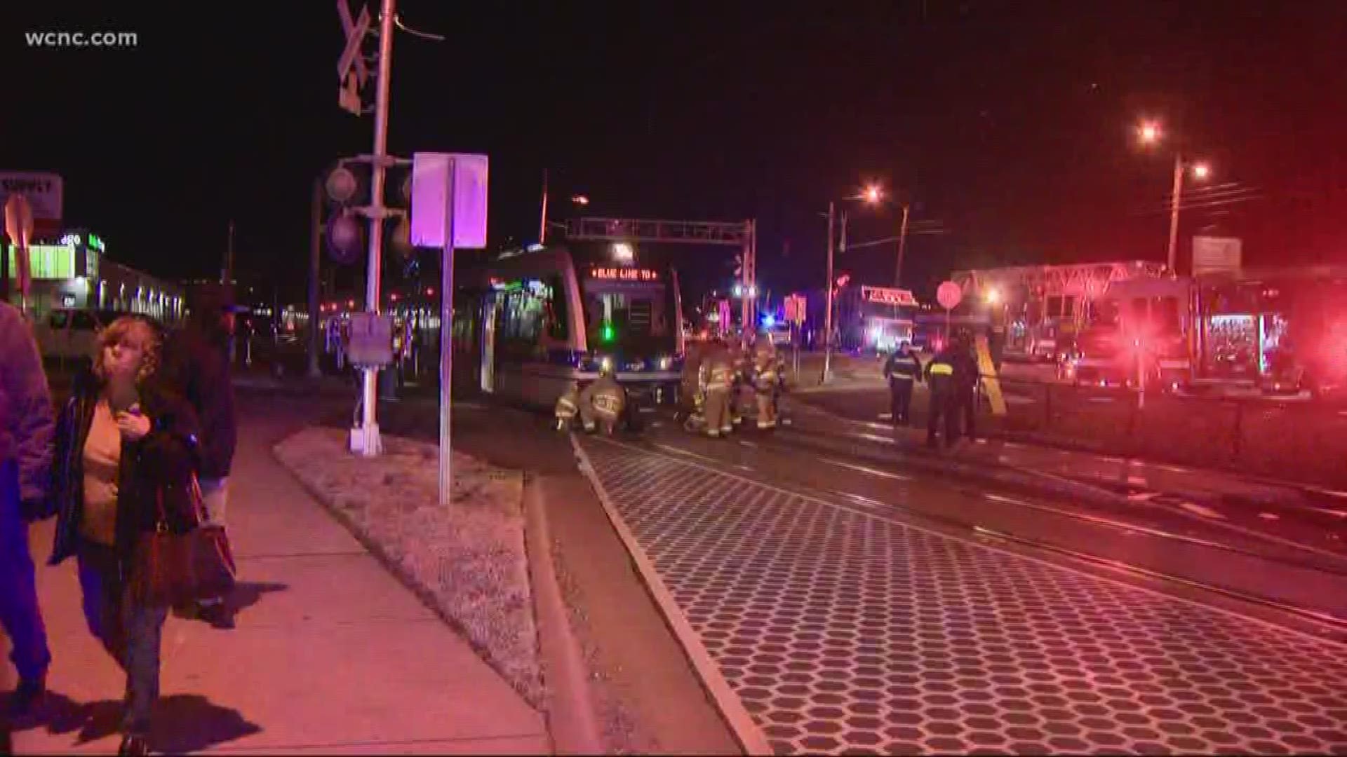 A man has died after he was pinned under a light rail train.