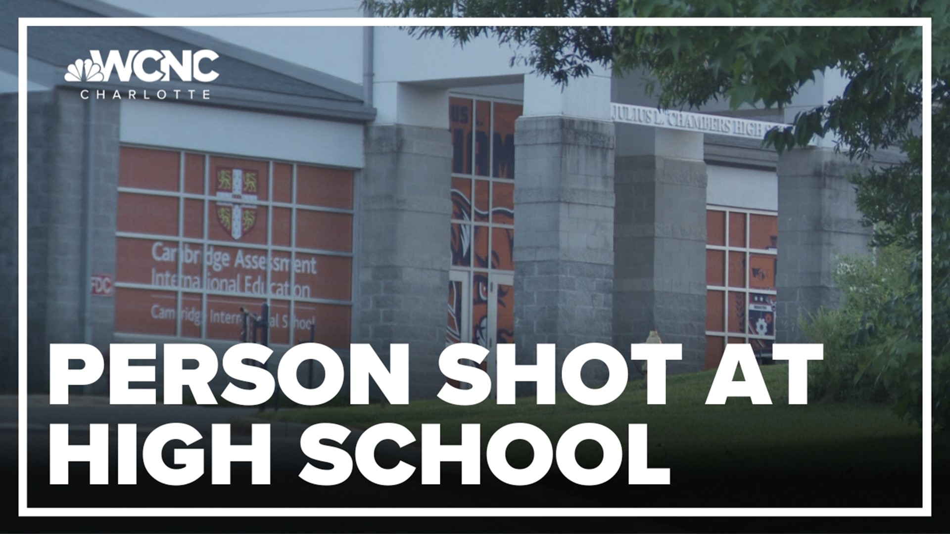 Police say one person was hurt after a fight between two adults led to a shooting at a high school.