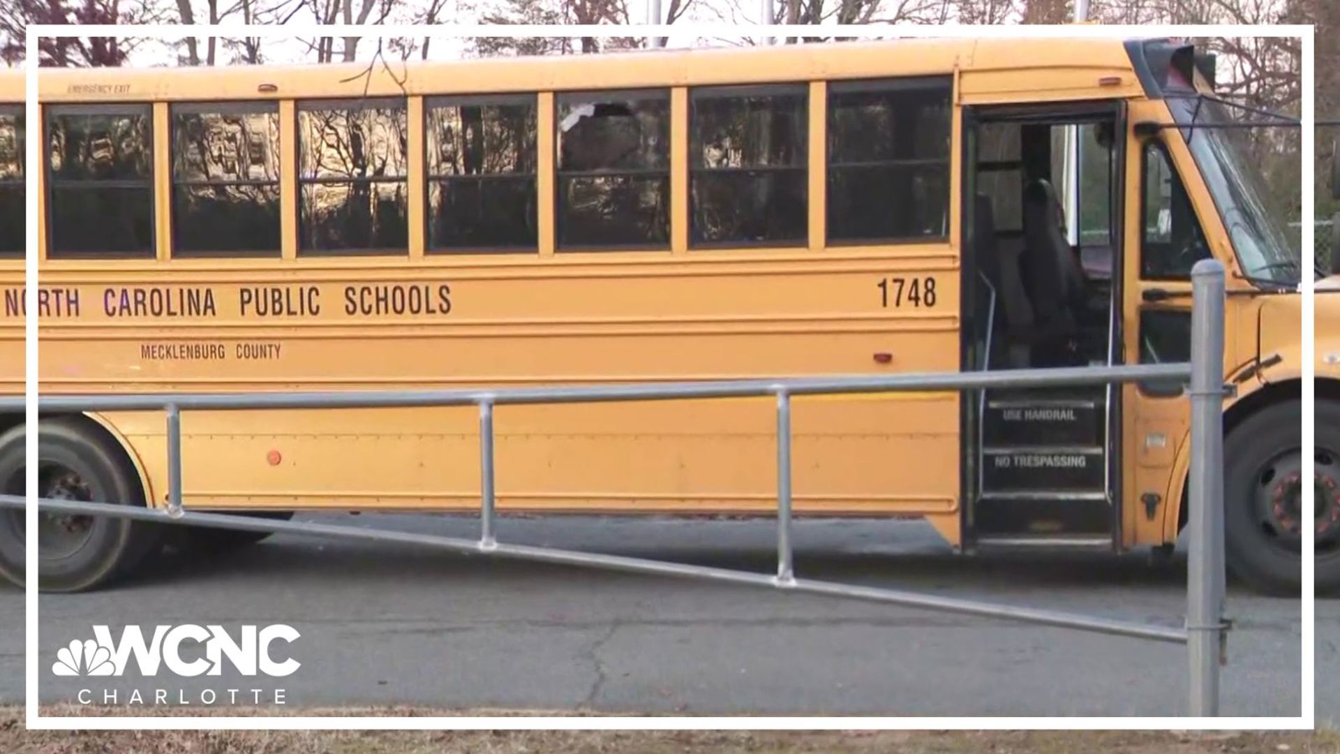 Two students were injured by shattered glass when gunfire struck a school bus in east Charlotte on Monday. A suspect was arrested, CMPD said. 