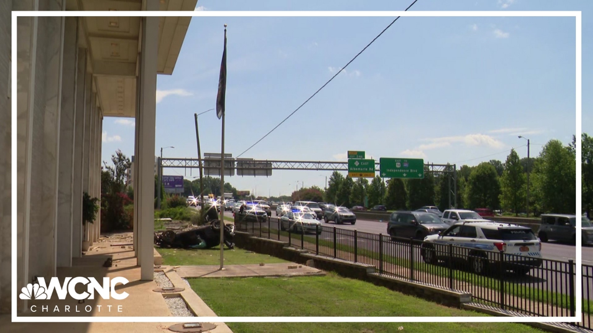 Dramatic surveillance video shows the moment a speeding car lost control and flipped through a wooden fence and crashed near an office building in east Charlotte.