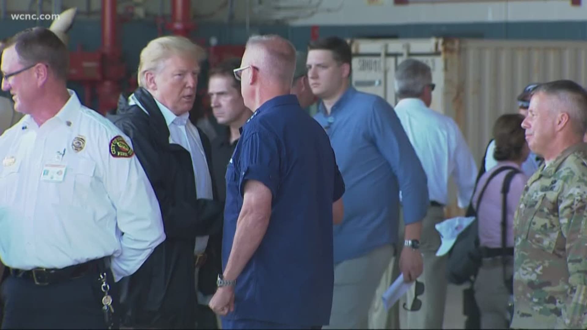 Handing out hot dogs, hugs and comforting words, President Donald Trump sought Wednesday to soothe those who suffered losses in Hurricane Florence, declaring that "America grieves for you" as he surveyed damage the powerful storm left behind.