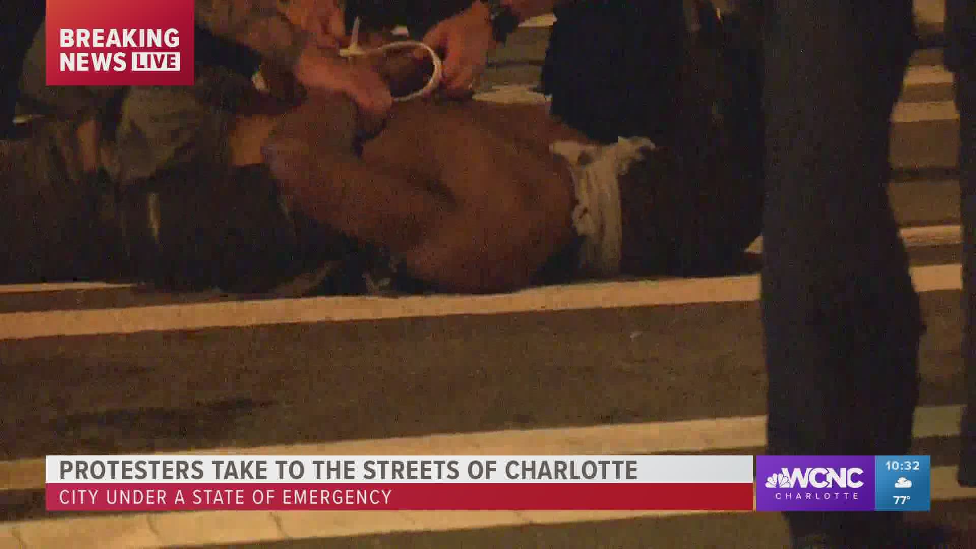 At least three people have been detained during protests in uptown Charlotte Saturday night, the Charlotte Mecklenburg Police Department confirmed.