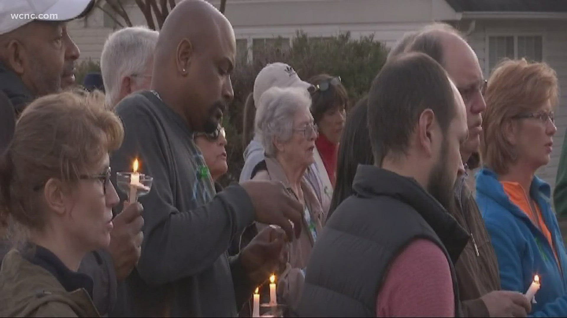 Candles lit up the night sky, as dozens showed love to a grieving family.