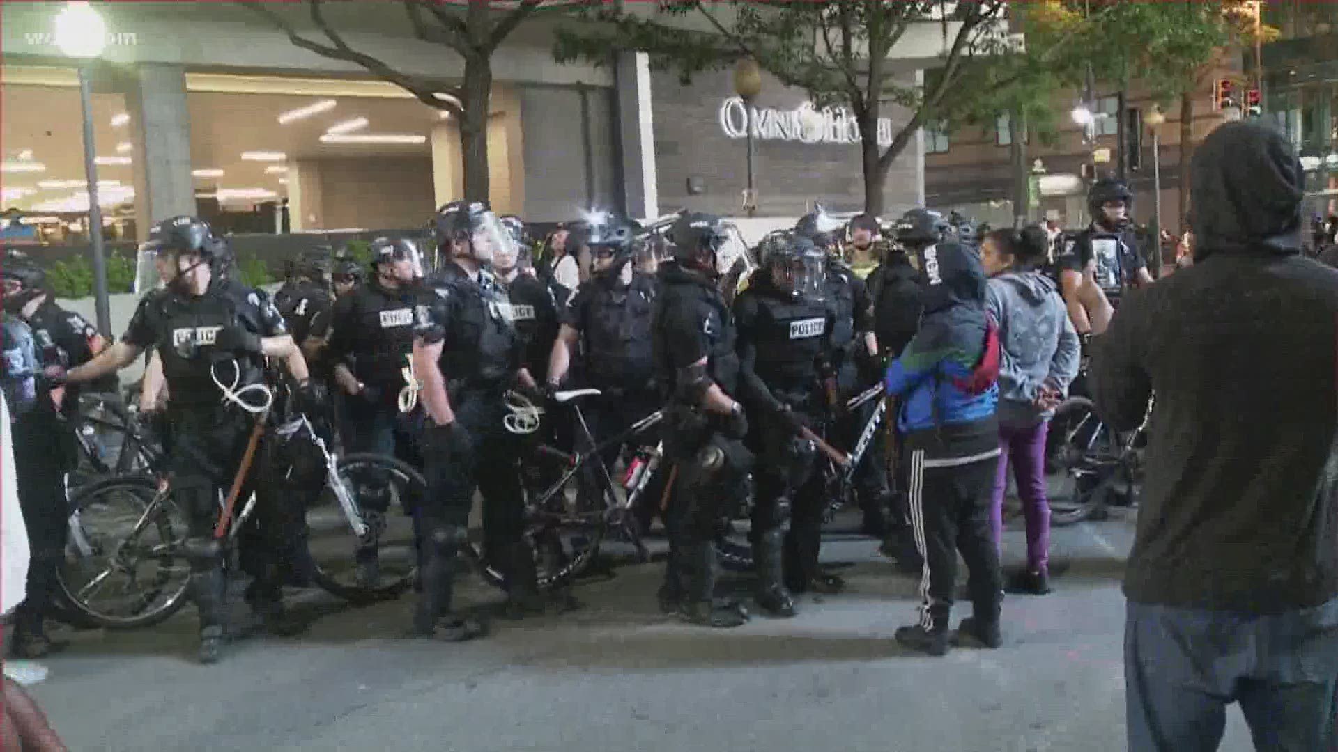 It's not known at this time why the woman was taken into custody at the Sunday protests in uptown Charlotte.