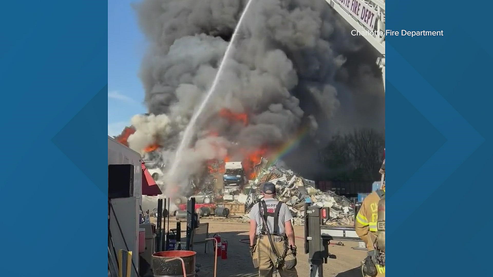 A pile of burning scrap in west Charlotte is sending a plume of black smoke into the air in west Charlotte.