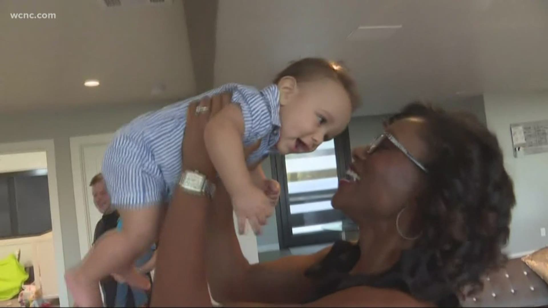 When a Charlotte woman couldn't have a child of her own, her fellow college alumnus stepped up to be a surrogate mother.