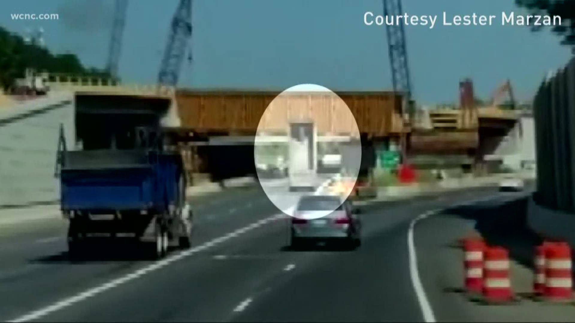 Cell phone video captured the moment when a dump truck woking on the I-77 toll lane crashed into an overpass under construction.