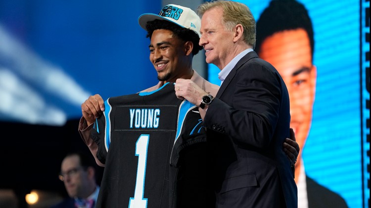 North Carolina State offensive tackle Ikem Ekwonu stands with NFL  Commissioner Roger Goodell after being picked by the Carolina Panthers with  the sixth pick of the NFL football draft Thursday, April 28