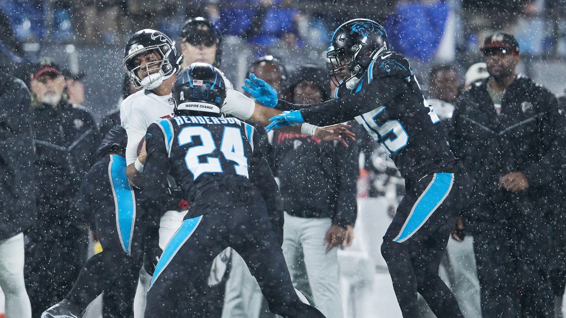 D'Onta Foreman leads Panthers past rival Falcons in rain