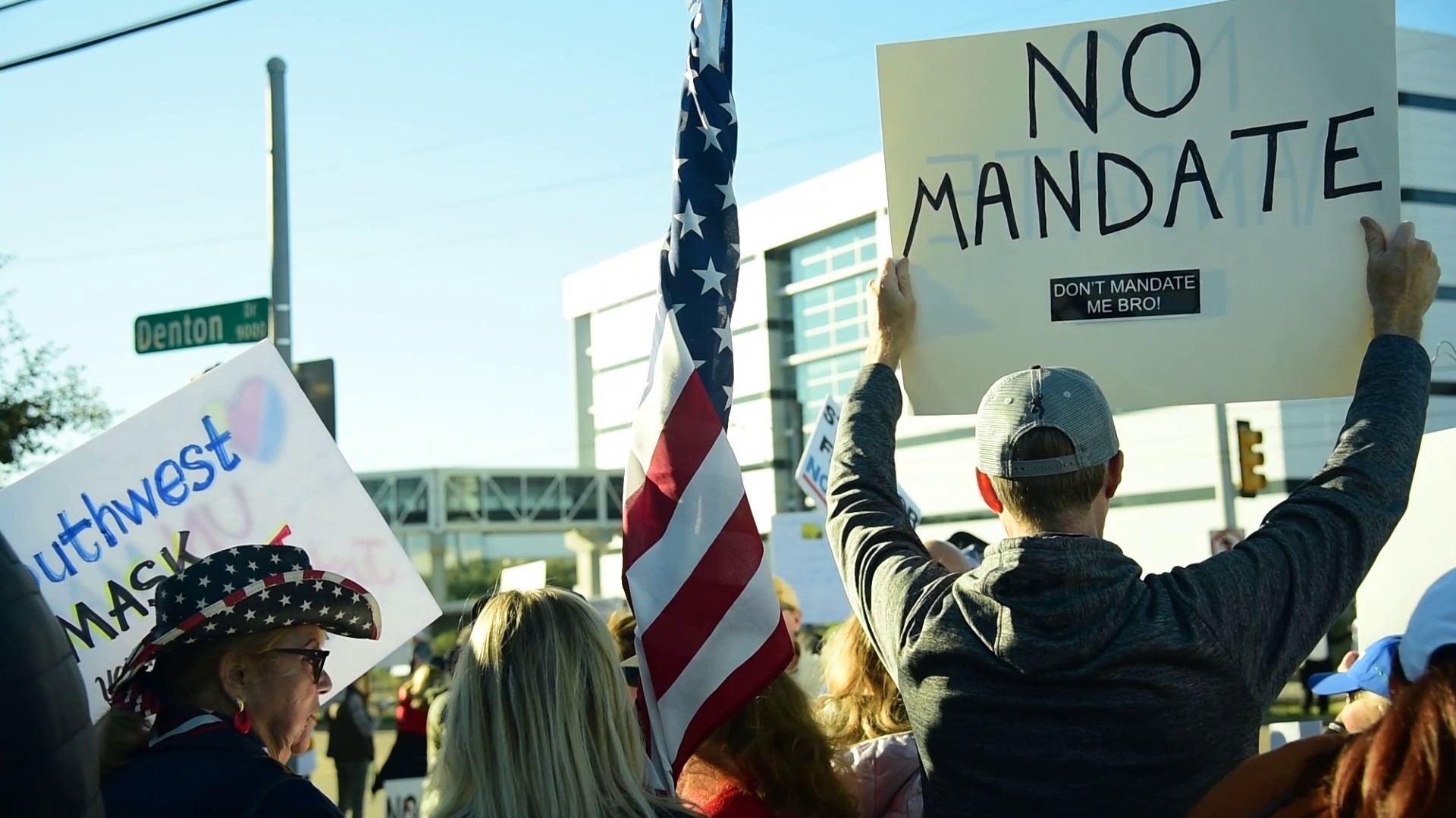 The group - including some employees from other airlines - showed up, Monday, with signs calling for 'jobs, not jabs' and 'freedom, not force.'