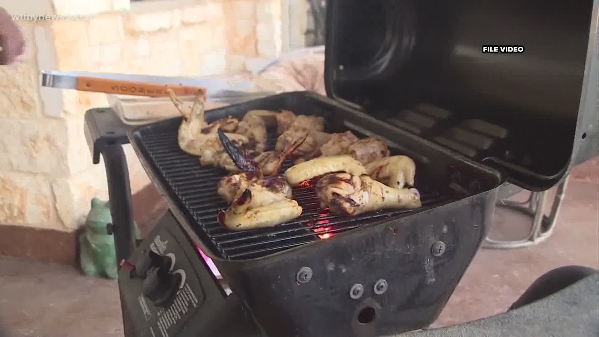 The first step in grilling is placing the grill in a safe area outside away from homes and deck railings.