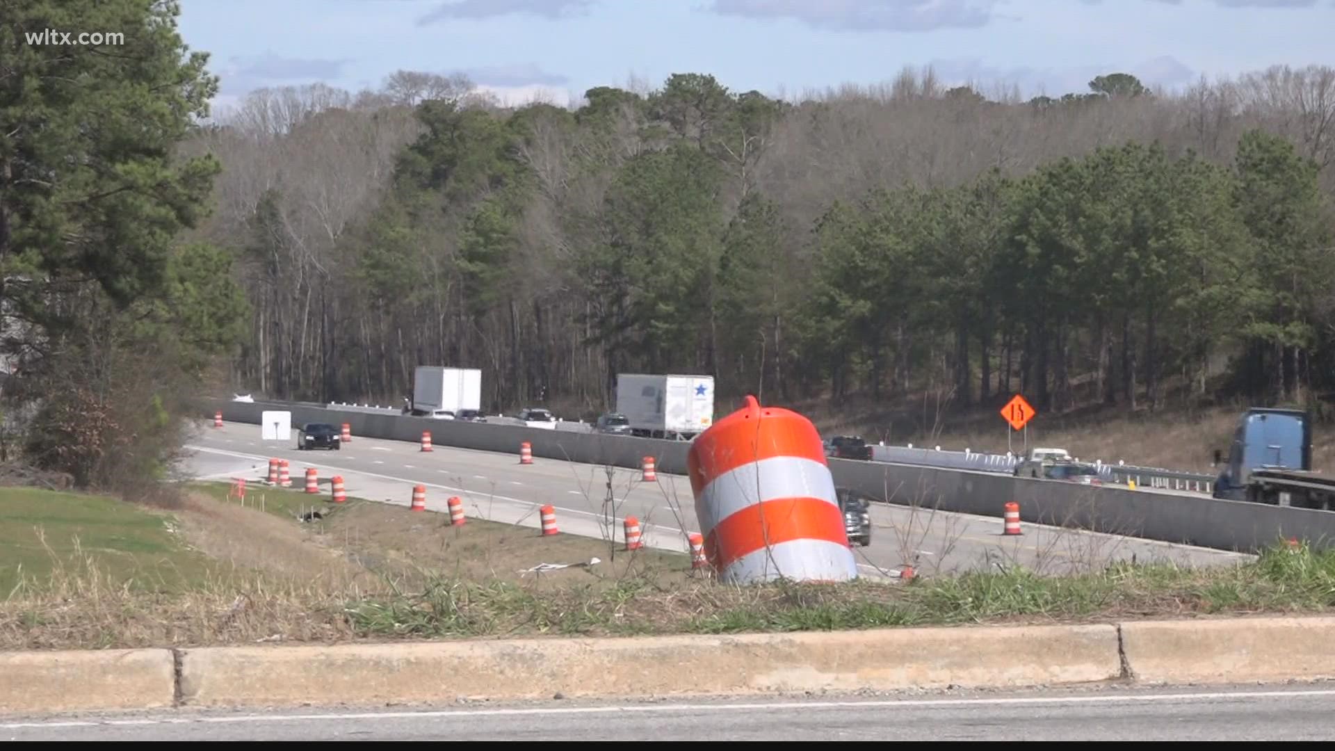 The 11-mile stretch has a widened barrier, new lanes, a noise barrier wall, and a bridge.