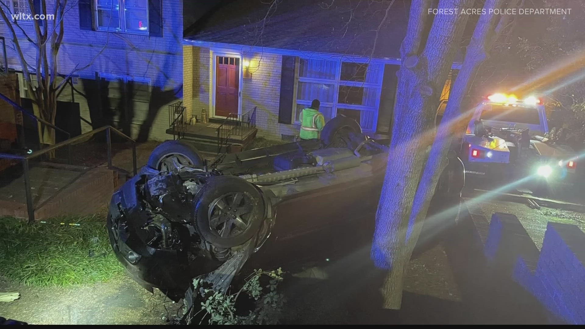 A woman is in custody after a police chase leaving her car crashed, upside down in front of a home.