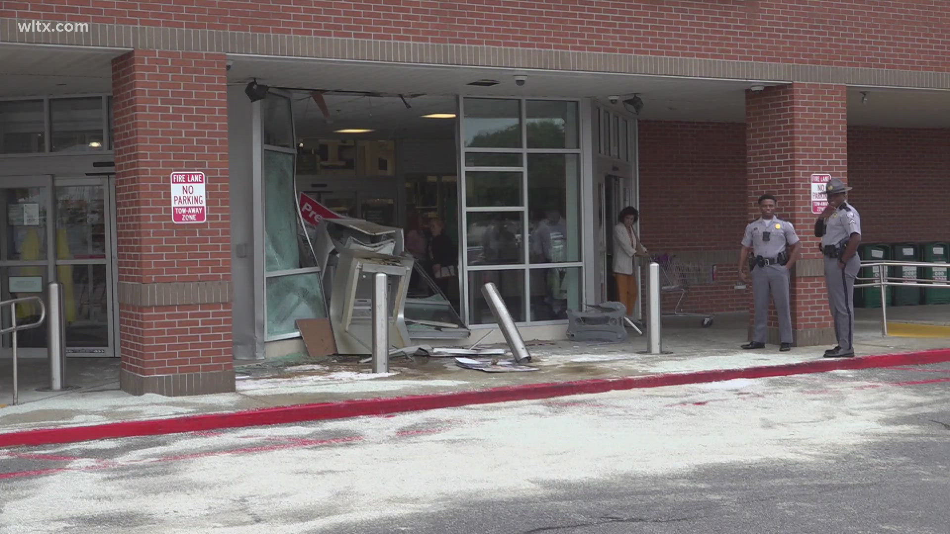 Around 11am the driver of the car hit the safety posts outside the building and crashed into part of the glass window.  Driver, passenger were taken to hospital. 