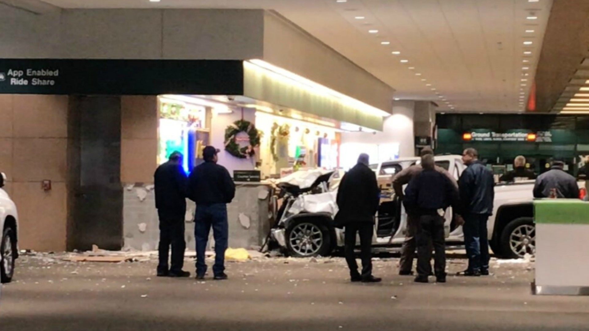 A truck crashed through a fence and wall at the airport. The driver is now in a medically induced coma.