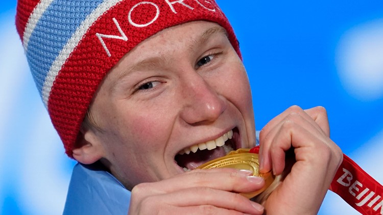 Why do Olympians bite their medals?